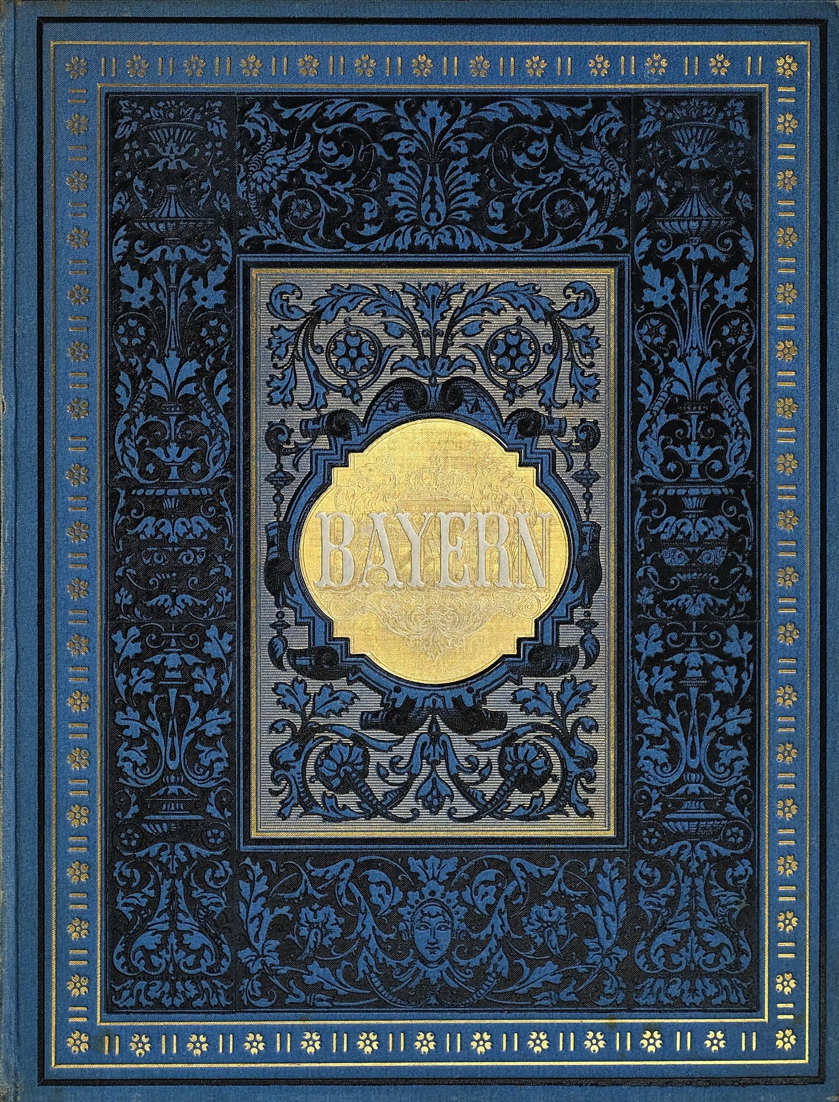 Ein blau-goldenes Buch mit dem Wort 'Bayern' auf einem kunstvoll gestalteten Cover.