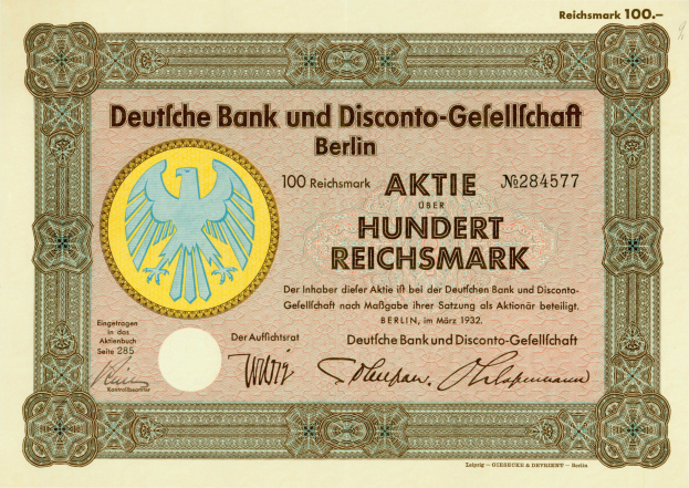 Eine alte deutsche Banknote mit einer Vogeldarstellung und dem Text "Deutsche Bank und Disconto-Gesellschaf Berlin".