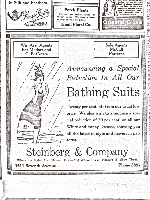 Eine Frau in einem weißen Rollkragenpullover mit langen Ärmeln und einem Dutt, die in der Mitte einer Steinberg & Company-Badeanzugwerbung sitzt, umgeben von Text.