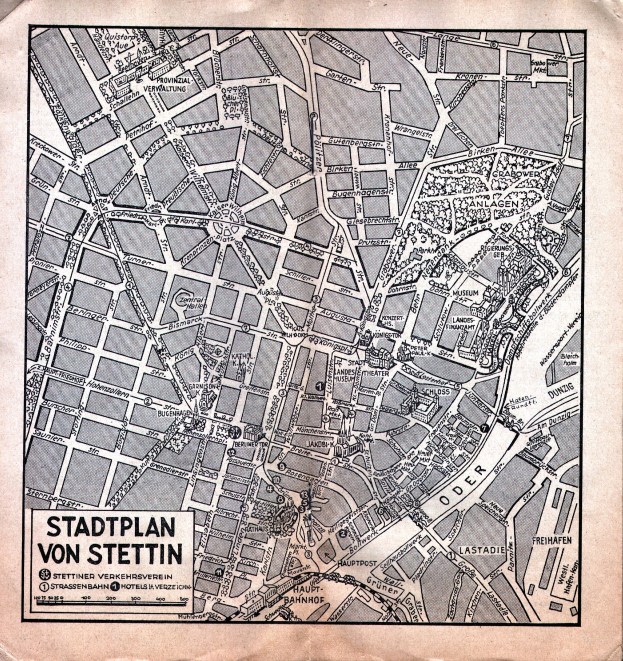 Ein altes, detailliertes Papier-Stadtplan von Stuttgart, der Straßen, Gebäude und Sehenswürdigkeiten zeigt, mit zusätzlichem Text für Informationen.
