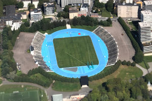 Luftaufnahme des Olympiastadions in München, Deutschland, umgeben von städtischer Infrastruktur und Grünflächen.